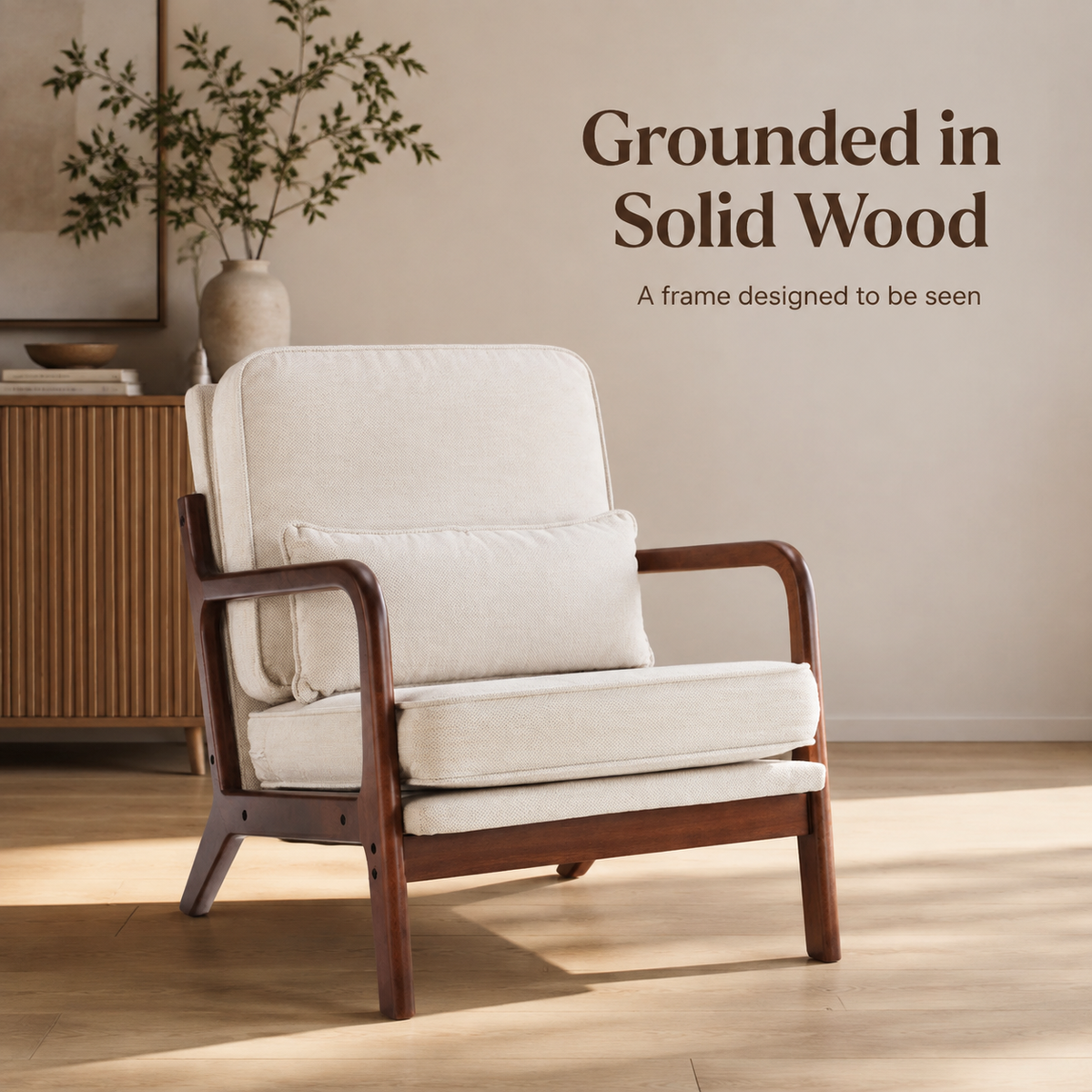 Beige accent chair showing its frame, armrests and four tapered legs