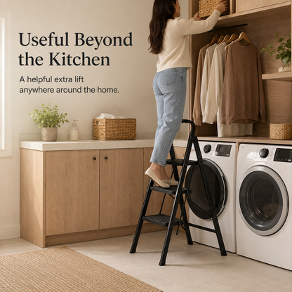 Woman using the Viva Elite black 3-step stool in a laundry and closet area