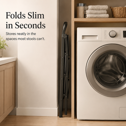 Viva Elite black 3-step folding stool stored slim beside a washer