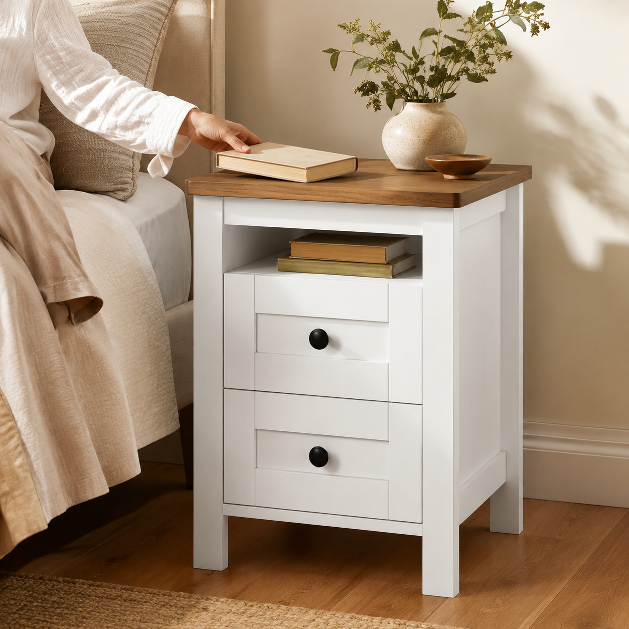 White bedside table in primary bedside use
