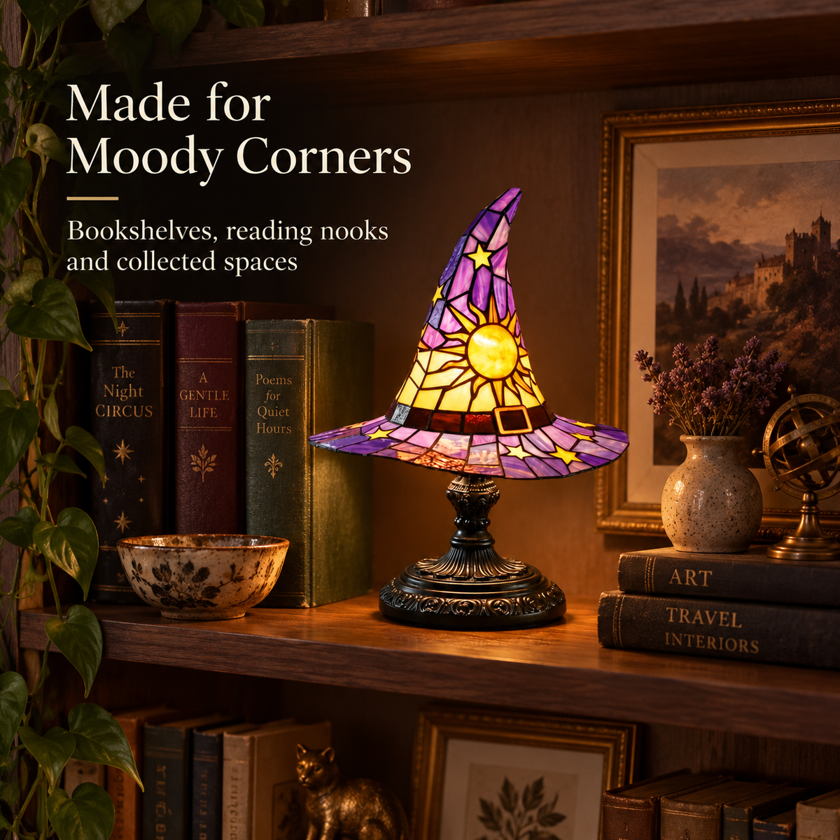 Witch hat accent lamp styled on a moody walnut bookshelf with books greenery and framed art