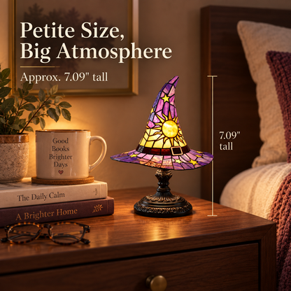 Petite witch hat accent lamp shown at approximately 7.09 inches tall beside books and a mug